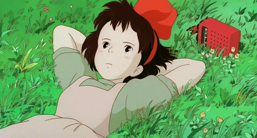 Studio Ghibli gif of Kiki lying in grass